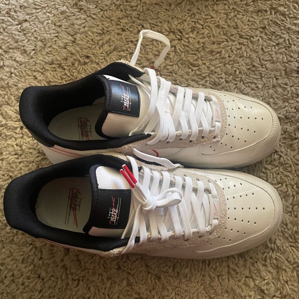 Nike Air Force 1 low script swoosh.